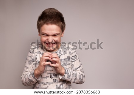 a boy with a sinister mean expression