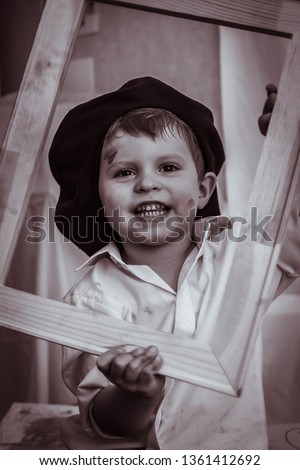 stylish little gentleman in hat looking up