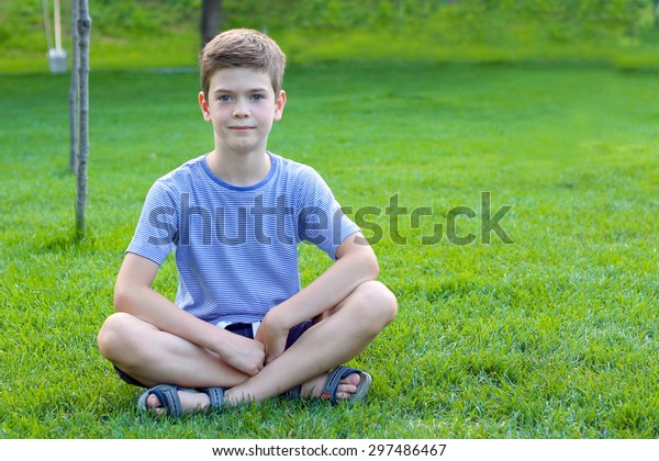 Boy Sitting Grass Park Stock Photo 297486467 | Shutterstock