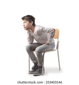 Boy Sitting On A Chair 