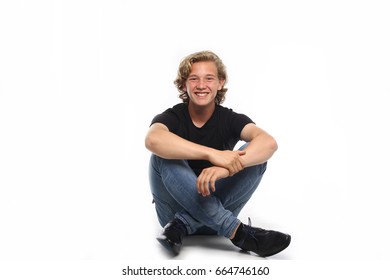 Boy Sitting On The Ground