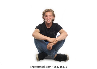 Boy Sitting On The Ground