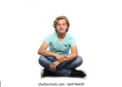 Boy Sitting On The Ground