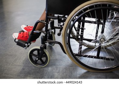 Boy Sitting On Wheelchair At School