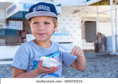 Boy  Six Years Old In Cap With Sign 