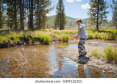 Boy Skimming Stones