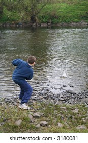 Boy Skimming Stones