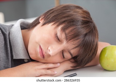 boy sleeping in class