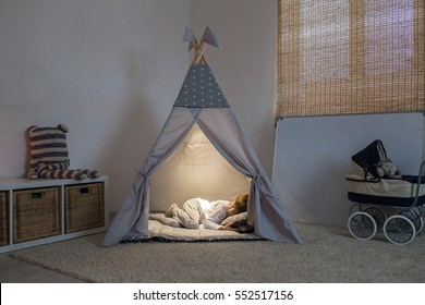 boy sleeps in the teepee - Powered by Shutterstock