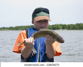 Boy With Slippery Fish