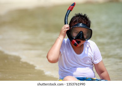 Boy  With Snorkle  In The Beautiful Sea Is Very Happy