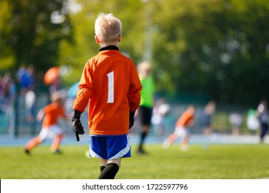 Boy Soccer Goalkeeper on the Field. Young Football Goalie on Kids Sports Competition. Junior Level Soccer Goalkeeping Background
