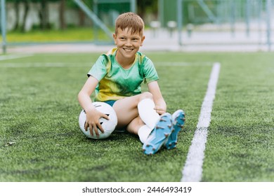 boy soccer player in sports uniform on the soccer field - Powered by Shutterstock