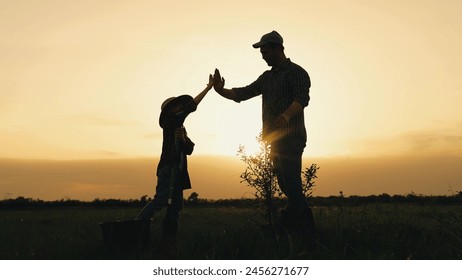 boy son child father tree shovel plant farmer gardener field garden silhouette sunset family parenting happy, childhood agricultural education, rural family bonding, joyful gardening moment, bonding - Powered by Shutterstock