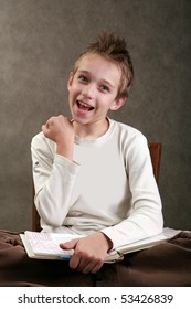 Boy With Spiky Hair Reading A Book