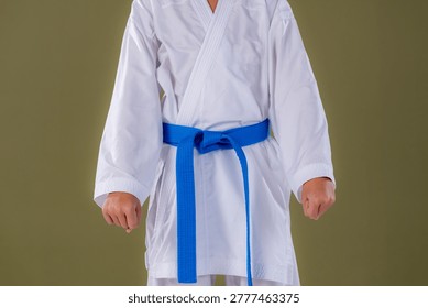 Boy standing in the basic karate stance Heisoku Dachi with aligned feet and upright posture. Highlights balance, discipline, and foundational martial arts form.