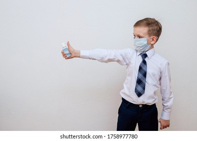 The Boy Is Standing With A Disinfectant Alcohol Gel In His Hand And A White Light On His Hands