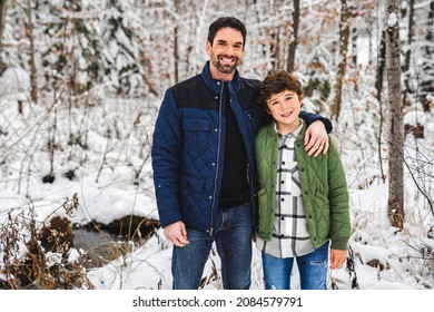 A Boy And Stepfather On Forest In Winter Season