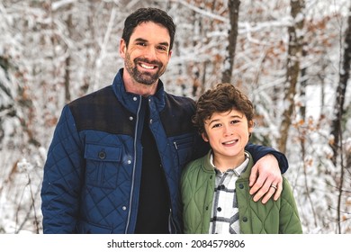 A Boy And Stepfather On Forest In Winter Season