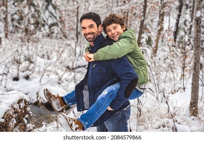 A Boy And Stepfather On Forest In Winter Season