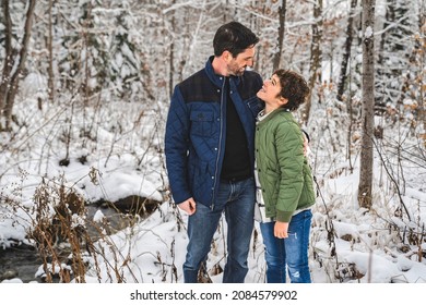 A Boy And Stepfather On Forest In Winter Season