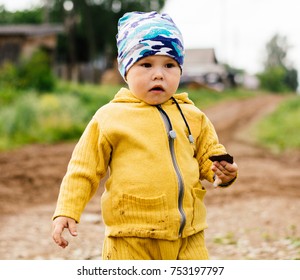 A boy with stone in hand