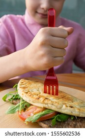 Boy Stuck A Fork Inside A Delicious Sandwich In A Restaurant