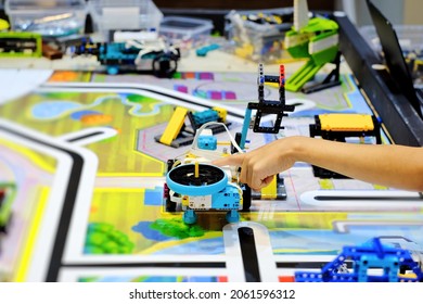 Boy Student Building And Testing His Lego Robotics Design Model For His STEM Project. Child Science, Engineering, Technology, Creativities And Education Background.