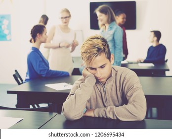 Boy student feeling uncomfortable at break between classes 