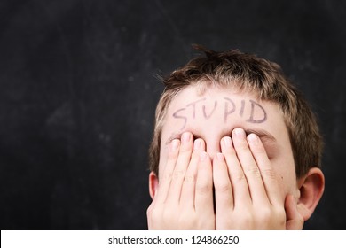 Boy With Stupid Written On His Forehead