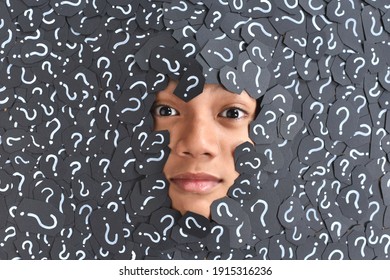 Boy submerged from question mark. Concept of question, curiosity and choices - Shutterstock ID 1915316236