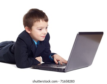 Boy in suit with laptop isolated on white background