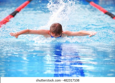  Boy swimming Butterfly in a race. 
