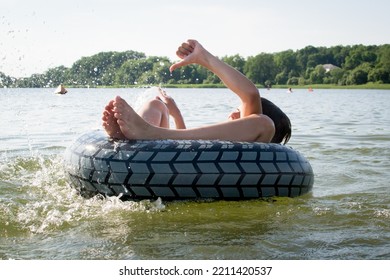 Boy Swimming In The Lake