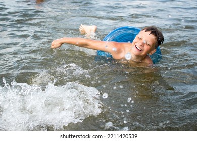 Boy Swimming In The Lake