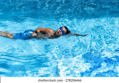 Boy swimming in pool
