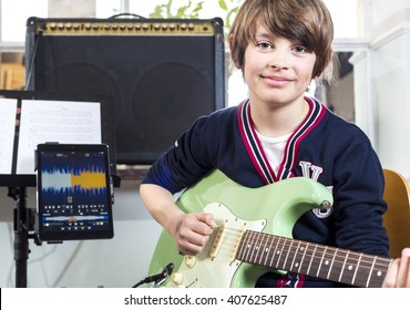 Boy talking guitar lessons - Powered by Shutterstock