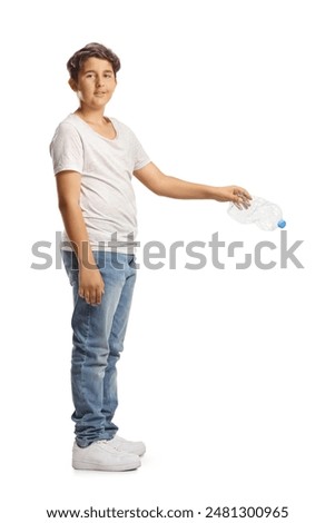 Boy throwing a plastic bottle and looking at camera isolated on white background