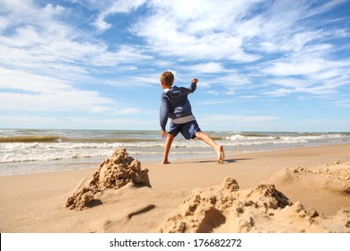 Boy throwing rocks into the lake - Powered by Shutterstock