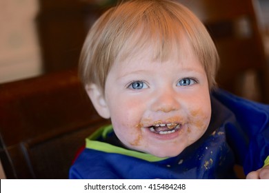 Boy Toddler Eating Peanut Butter With Messy Face