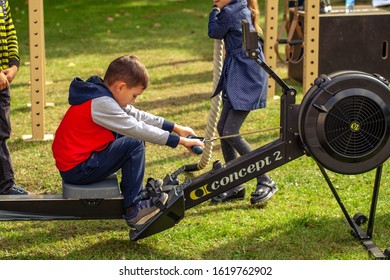 Boy Training On A Rowing Machine At National Competition 