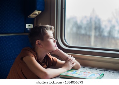 Boy Traveling By Train, Look At Window