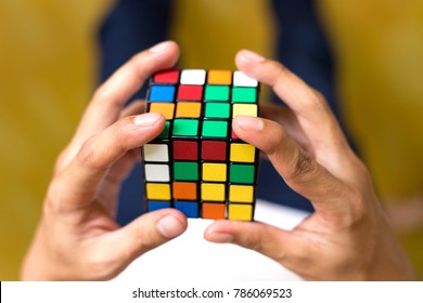 A Boy Trying To Solving The 4 By 4 Rubic Cube