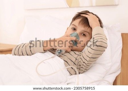 Similar – Image, Stock Photo Cute preteen boy inhales the air of freedom from car window during family road trip and enjoy of pleasant expectation of happy vacation. Joyful child travel with parents
