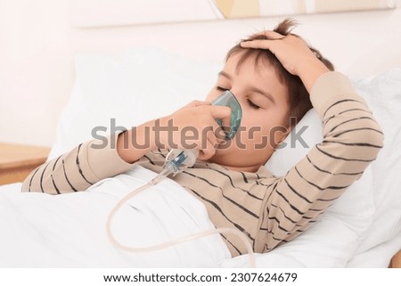 Similar – Image, Stock Photo Cute preteen boy inhales the air of freedom from car window during family road trip and enjoy of pleasant expectation of happy vacation. Joyful child travel with parents