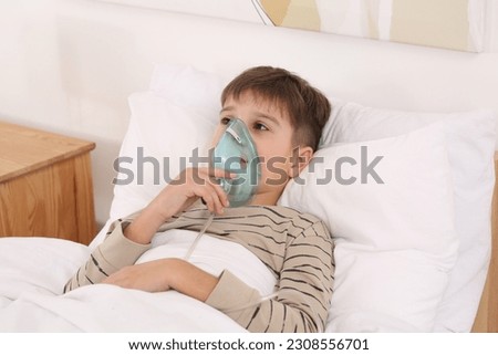 Similar – Image, Stock Photo Cute preteen boy inhales the air of freedom from car window during family road trip and enjoy of pleasant expectation of happy vacation. Joyful child travel with parents