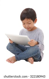 Boy Using Tablet While Sitting On The Floor. Asian Child Using Computer. Asian Boy Using Tablet. Asian Boy Use Computer. Kid Use Computer. Asian Kid Using Tablet.