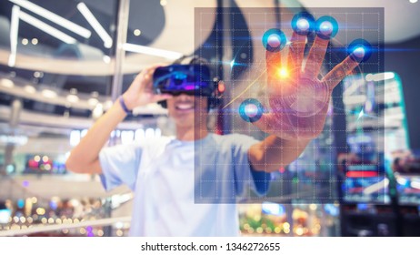 a boy using a virtual reality headset, touch to virtual interface 