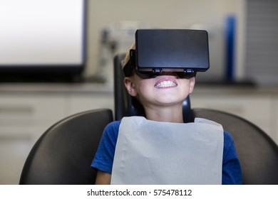 Boy using virtual reality headset during a dental visit in clinic - Powered by Shutterstock