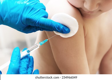Boy and vaccine syringe